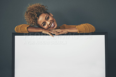 Buy stock photo Woman standing with blank sign or portrait frame, showing copy space for advertising or marketing on dark background. Happy, smiling and relaxed Afro female portrait with big white poster copyspace 