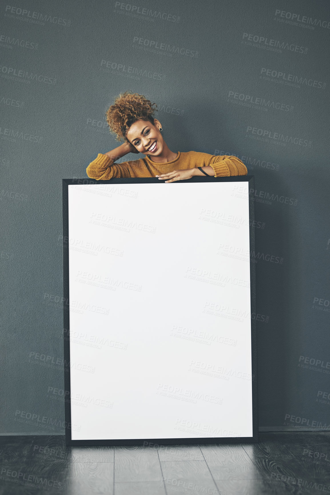 Buy stock photo A beautiful confident woman holding a blank whiteboard or billboard sign with copy space. Happy and attractive female with a smile standing behind a banner. Young lady advertising with a poster