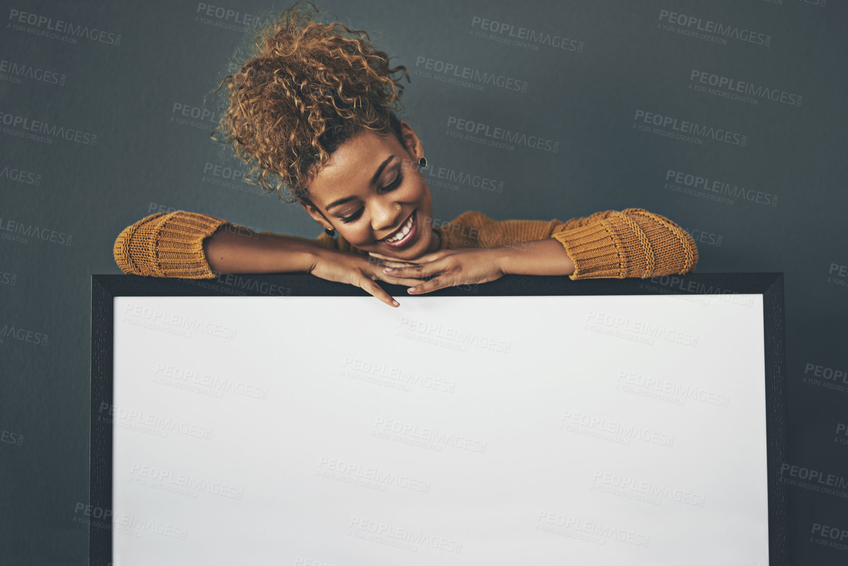 Buy stock photo Woman holding blank poster, copy space board and placard sign to promote, market and advertise opinion or voice on female empowerment. Smiling, young and happy lady endorsing with billboard in studio