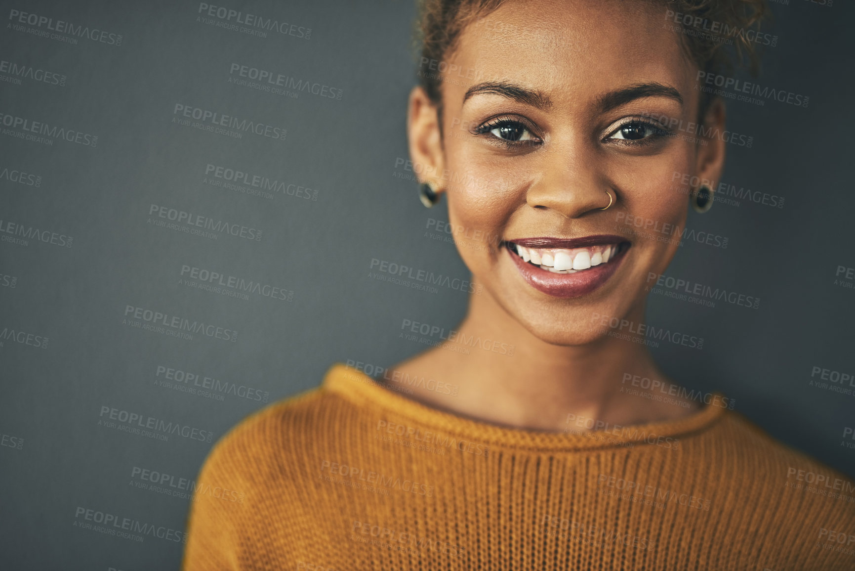 Buy stock photo Portrait, smile and woman with piercings in studio for alternative style, jewellery and confidence. Positive, happy and face of female person with cosmetic, makeup and fashion on gray background 