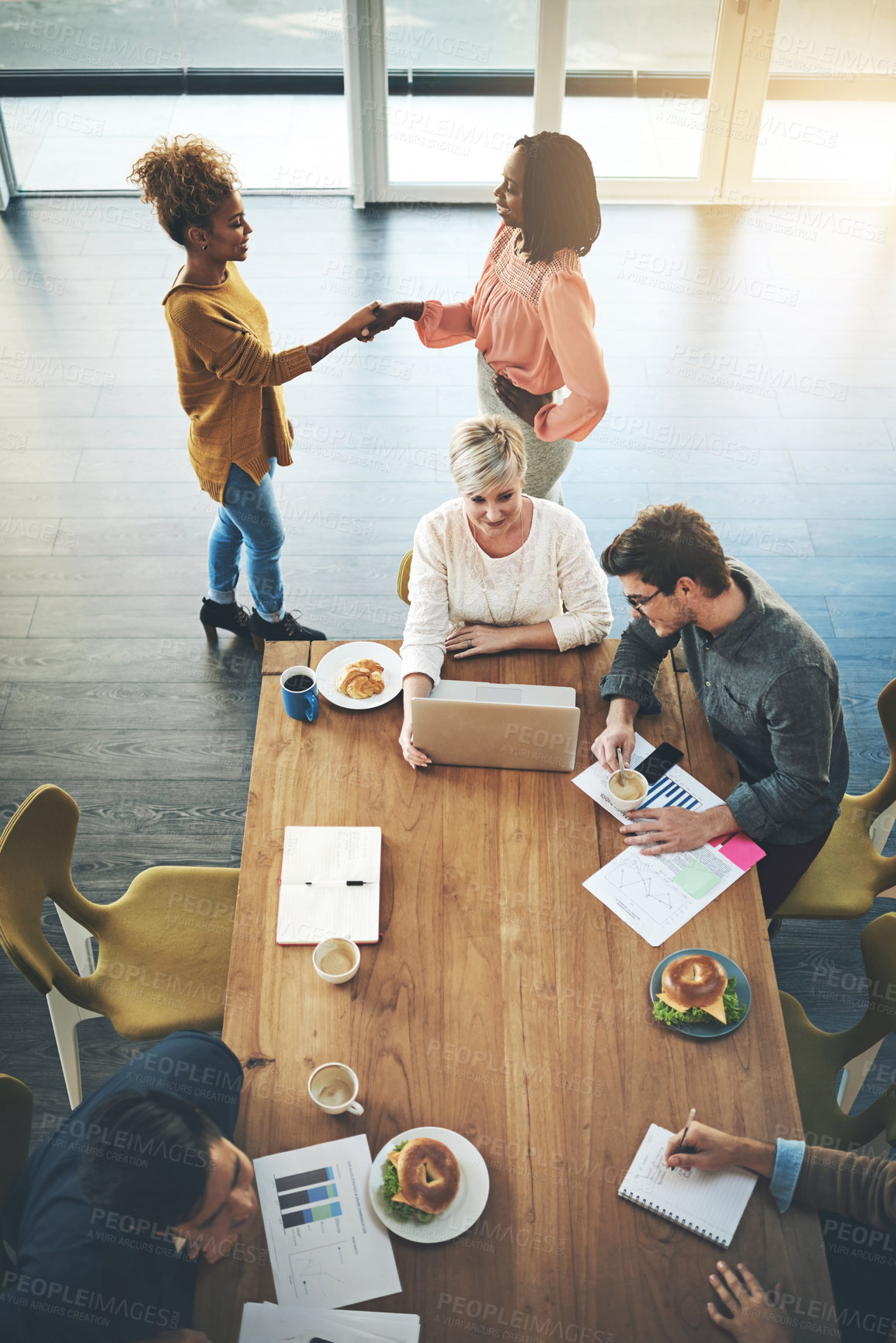 Buy stock photo high angle shot of a group of businesspeople working in an office