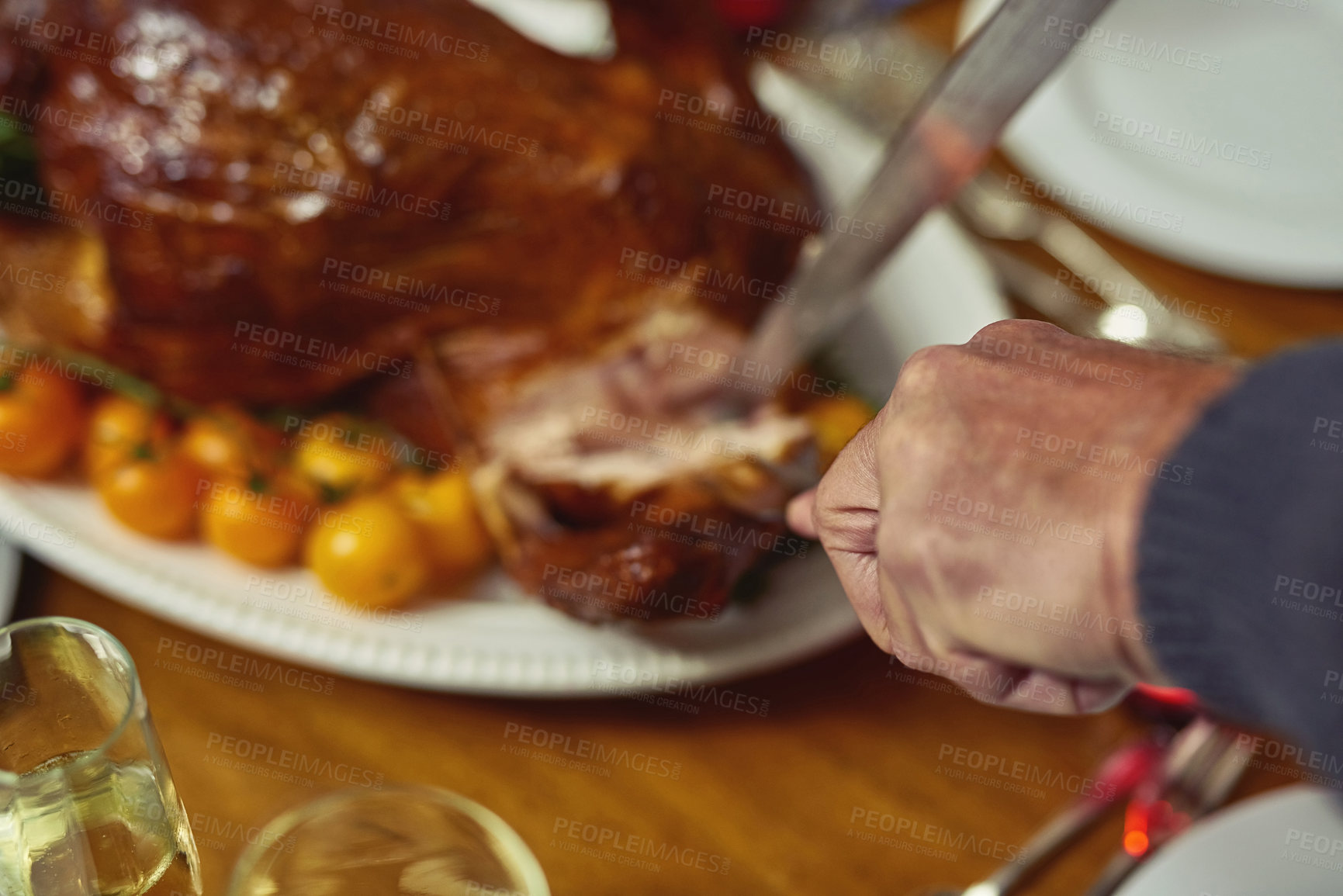 Buy stock photo Hands, turkey and cutting for feast, dinner and meat for reunion of family, thanksgiving or celebration. Chicken, fork and knife for slice, holiday or people in dining room, Christmas or food in home