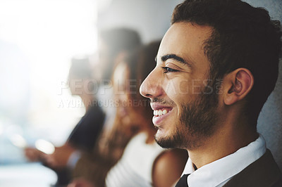 Buy stock photo Shot of a young businessman standing with coworker