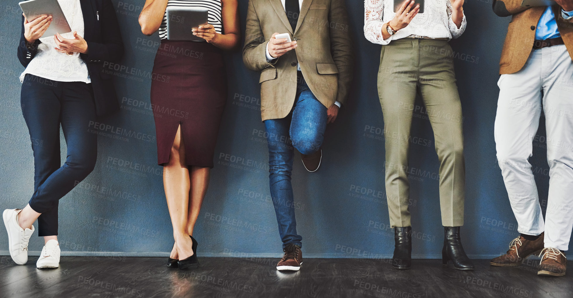 Buy stock photo Connected, communication and network of diverse businesspeople using multimedia technology, waiting for an interview. Professional group standing in a row, browsing social media with online apps