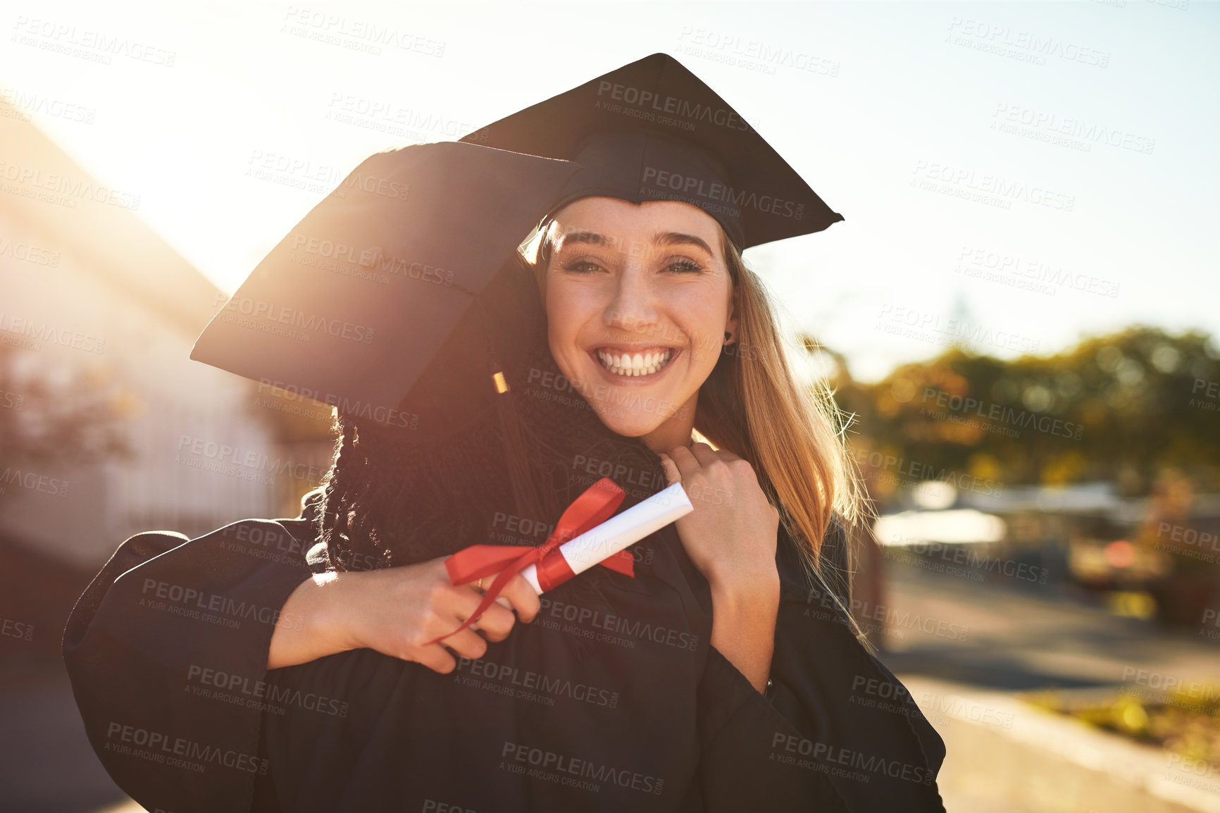 Buy stock photo Hug, friends and outdoor graduation portrait, diploma celebration and solidarity for support. People, learners and certified together for university success, embrace and degree achievement goals