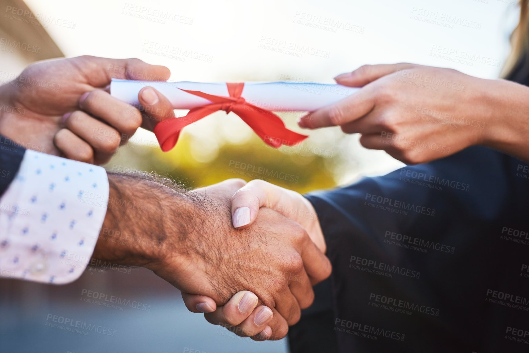 Buy stock photo Graduation certificate, closeup and people shaking hands for learning success, education development. College, outdoor or professor in school ceremony for students achievement, goal or giving diploma