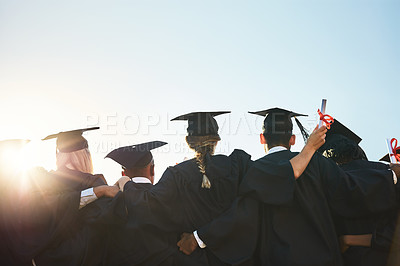 Buy stock photo Group, students and graduation for college or university friends together with blue sky mockup. Men and women outdoor to celebrate education achievement, success and future at event for graduates