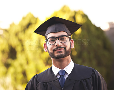 Buy stock photo Portrait, student and man graduate at university for success or learning achievement. Face, glasses and person at graduation for education goal, future career or confidence at college outdoor in UAE