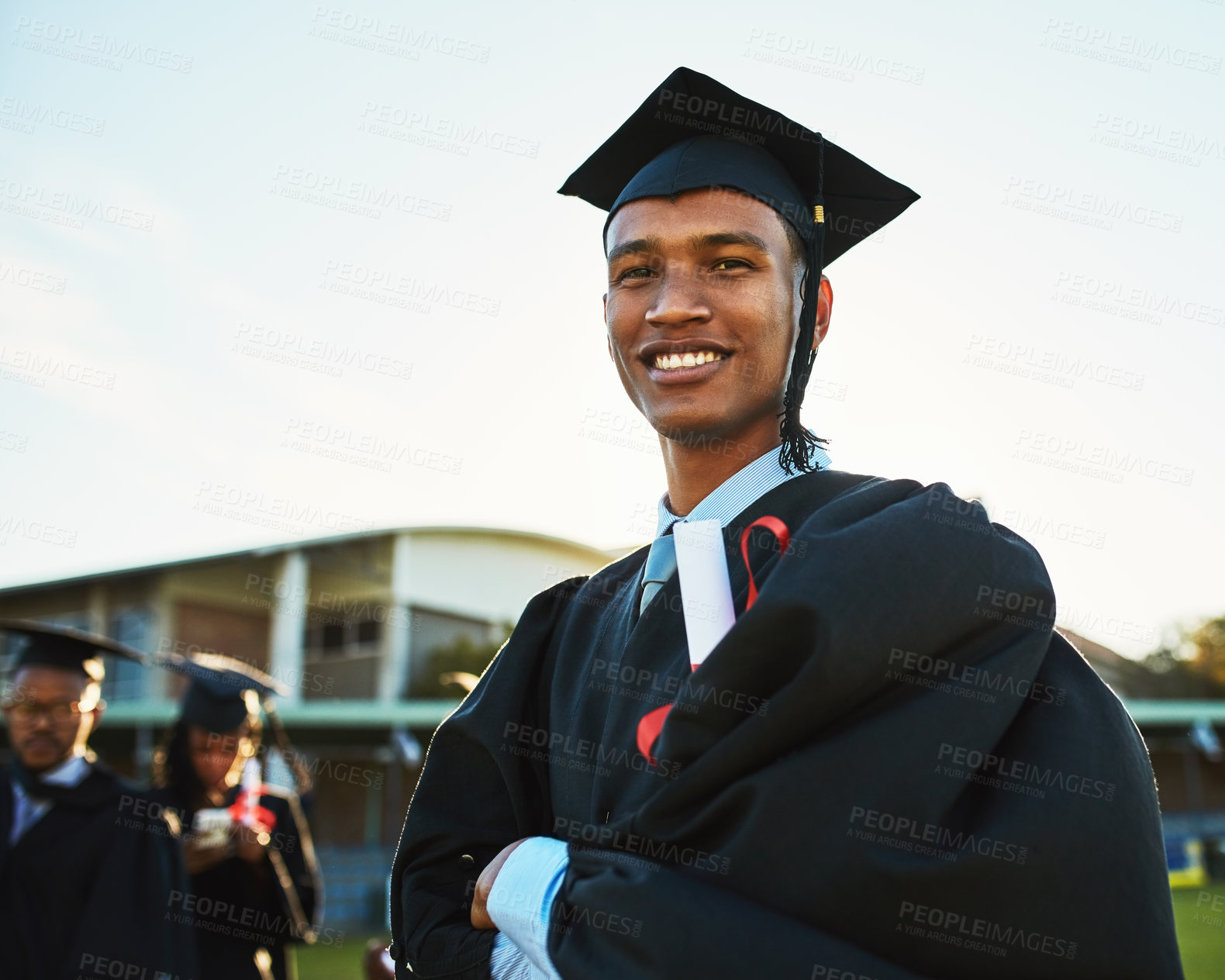 Buy stock photo Black man, student and arms crossed at outdoor graduation, celebration and dream achievement. Male person, learning pride and certified for university success, education victory and knowledge goals
