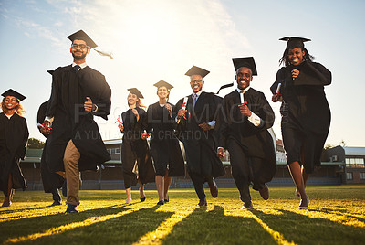 Buy stock photo Graduation, run and people on campus lawn with college success, student celebration and diploma event at university. Friends, outdoor and achievement with ceremony, freedom and happy for future below