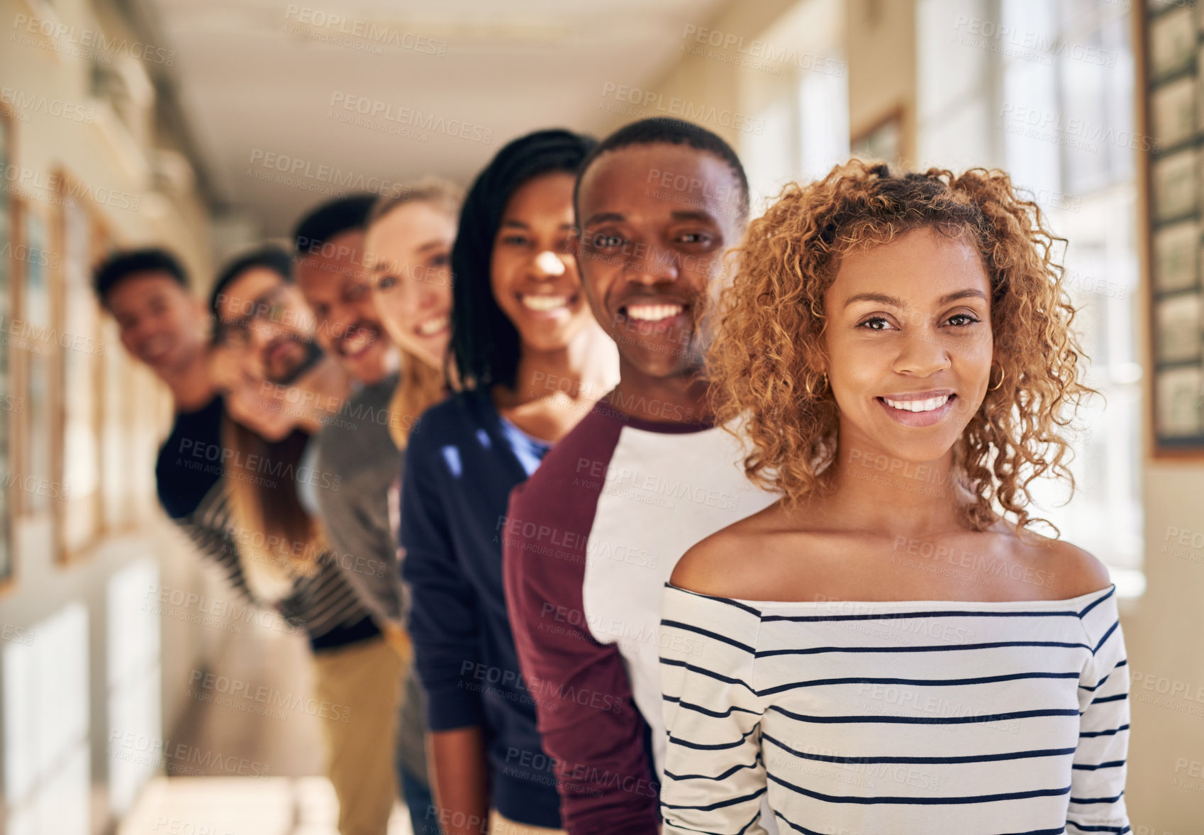 Buy stock photo Portrait of a diverse group of students standing in a line at campus