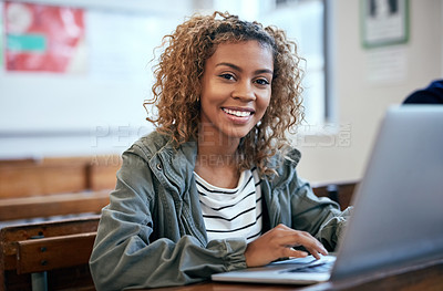 Buy stock photo Cropped shot of an university student using a laptop in class