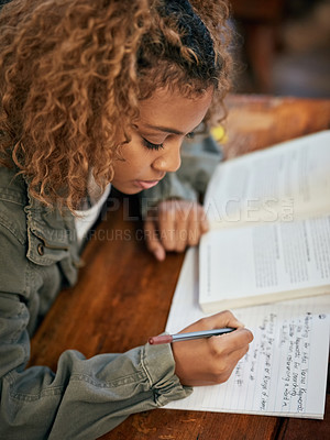 Buy stock photo Cropped shot of an university student writing notes in class