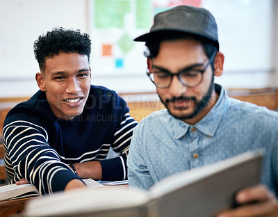 Buy stock photo Cropped shot of university students studying together in class