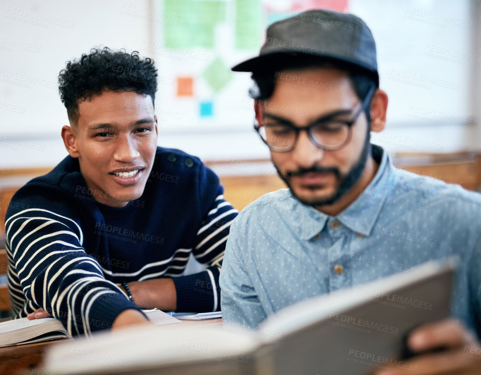 Buy stock photo Cropped shot of university students studying together in class