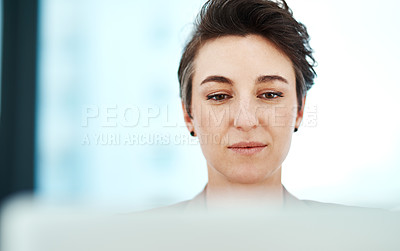 Buy stock photo Cropped shot of a young designer working at her desk