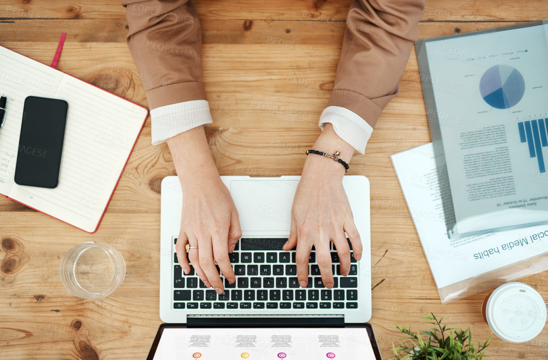 Buy stock photo High angle shot of an unrecognizable businessman using his laptop