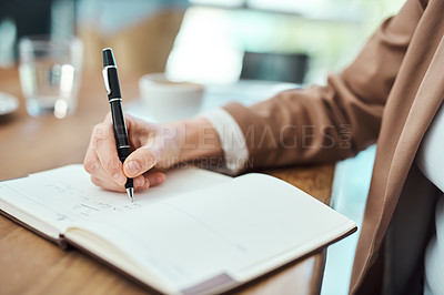 Buy stock photo Closeup shot of a businesswoman writing notes in office