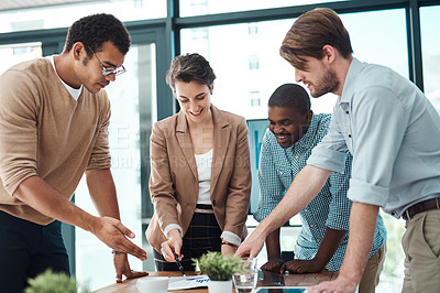 Buy stock photo Shot of a group of businesspeople having a discussion in an office