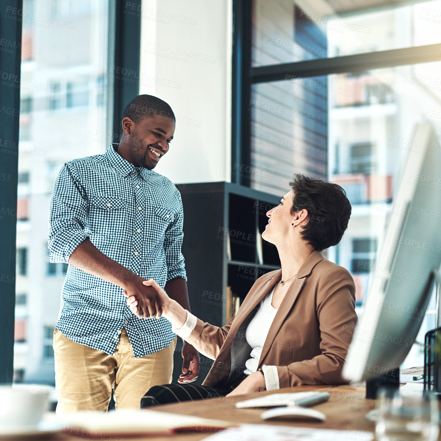 Buy stock photo Shot of designer shaking hands in the office