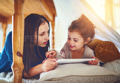 Buy stock photo House, mother and girl with tablet, digital app and social media with happiness, bonding together or relax. Family, single parent or mama with daughter, tech or love with cartoon movie or online game