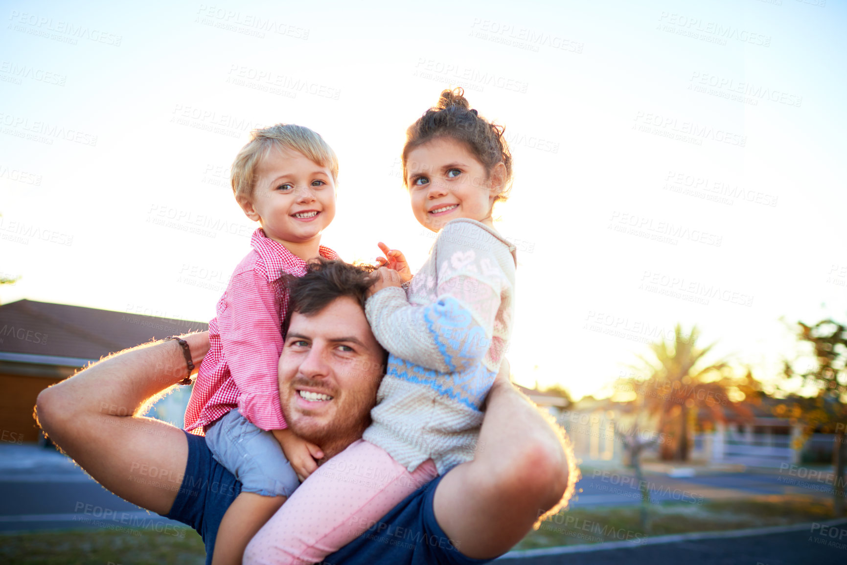 Buy stock photo Smile, portrait and father with children on shoulders for bonding, playing and having fun together. Happy, family and dad carrying girl kids for connection outdoor in backyard of home in Canada.