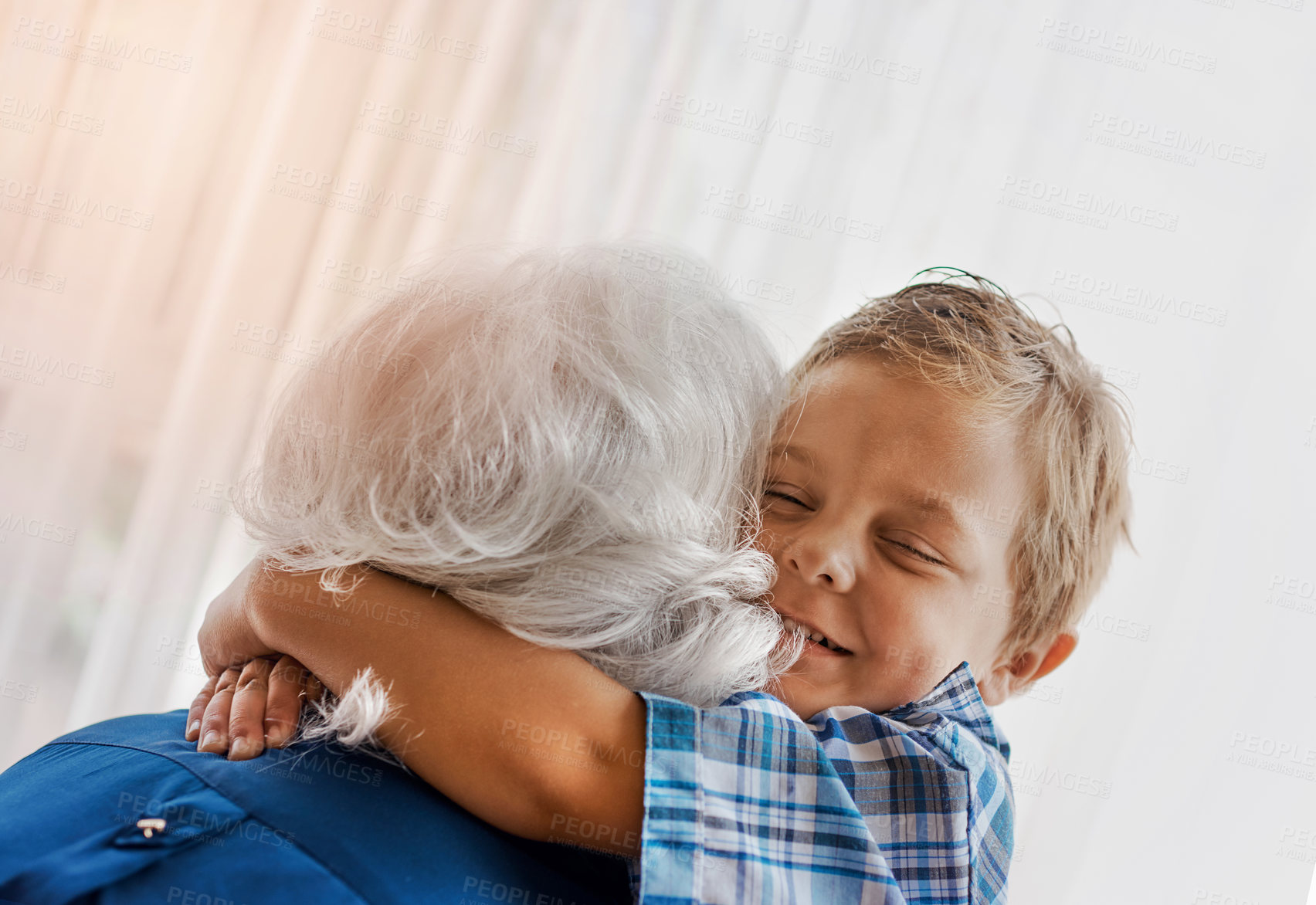 Buy stock photo Happy, child and hug with grandmother in home for support, appreciation and bonding together on weekend. Little boy, smile and embrace with woman in house for love, gratitude and trust in connection