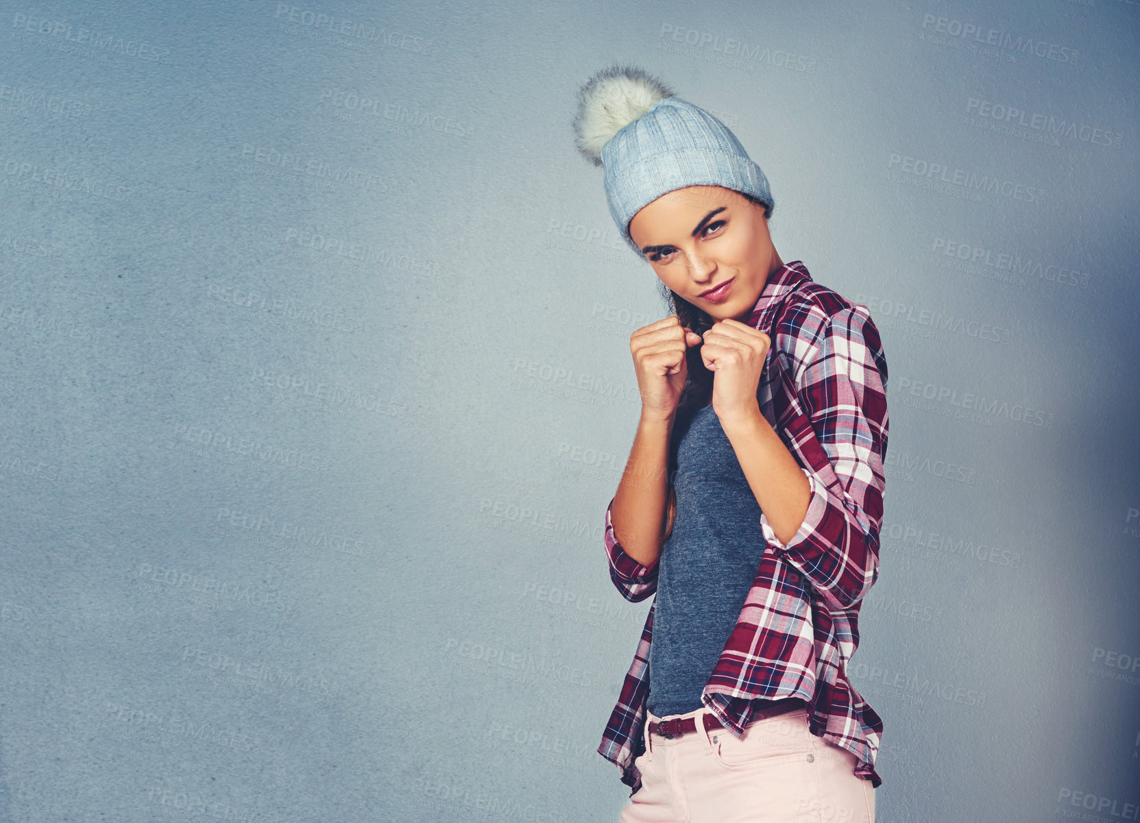 Buy stock photo Cropped shot of an attractive woman ready for a fight