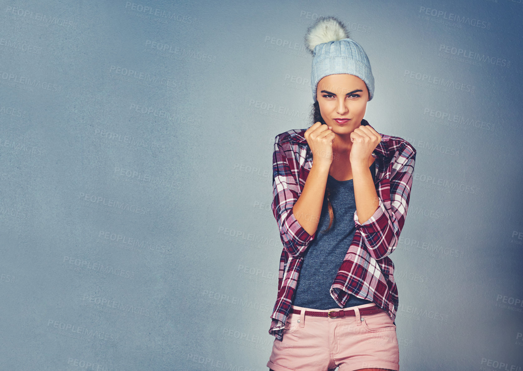 Buy stock photo Cropped shot of an attractive woman ready for a fight