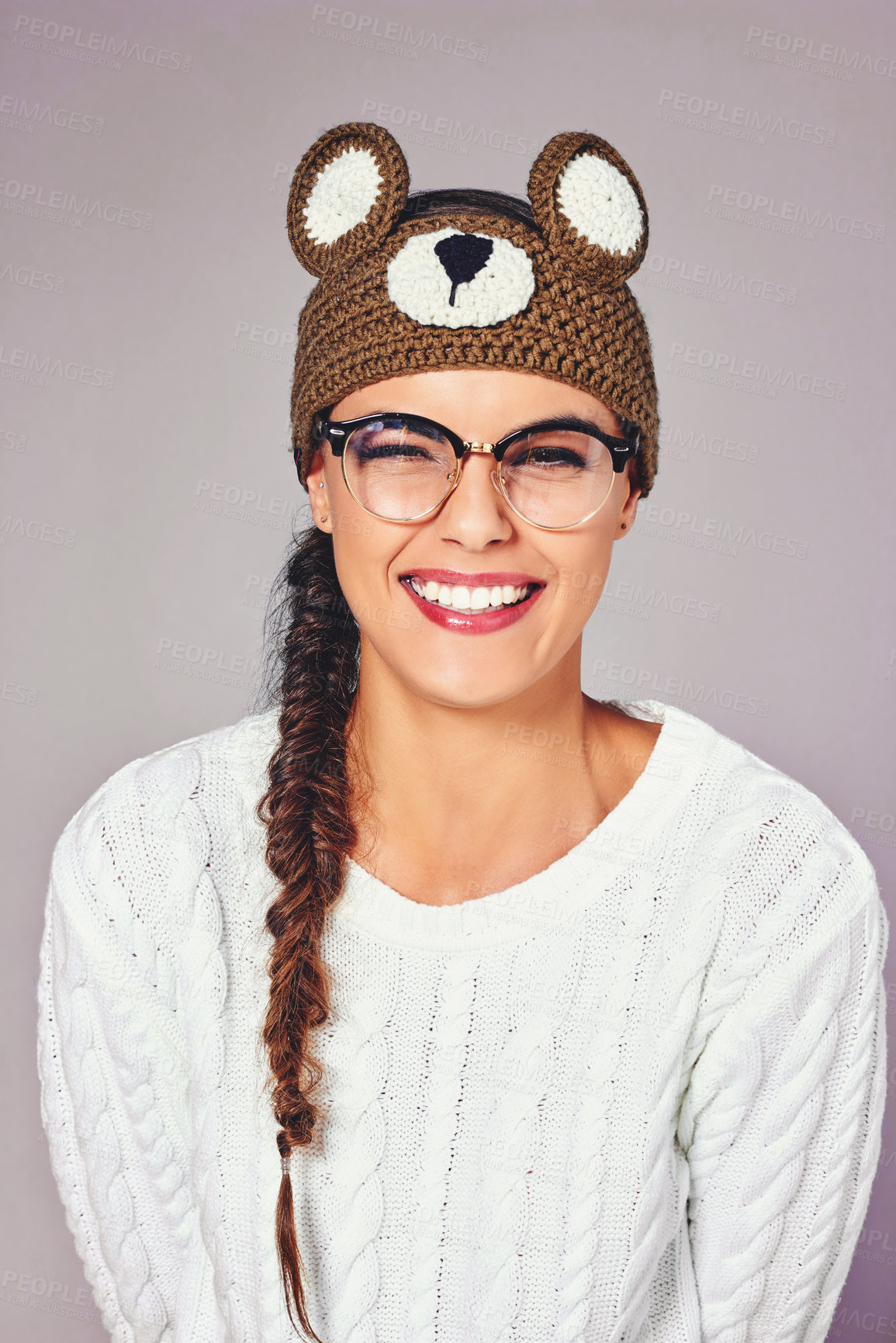 Buy stock photo Studio, woman and laughing in portrait for fashion, winter outfit and teddy bear beanie for style. Female person, smile and joke with confidence for crochet headband, wool and isolated background