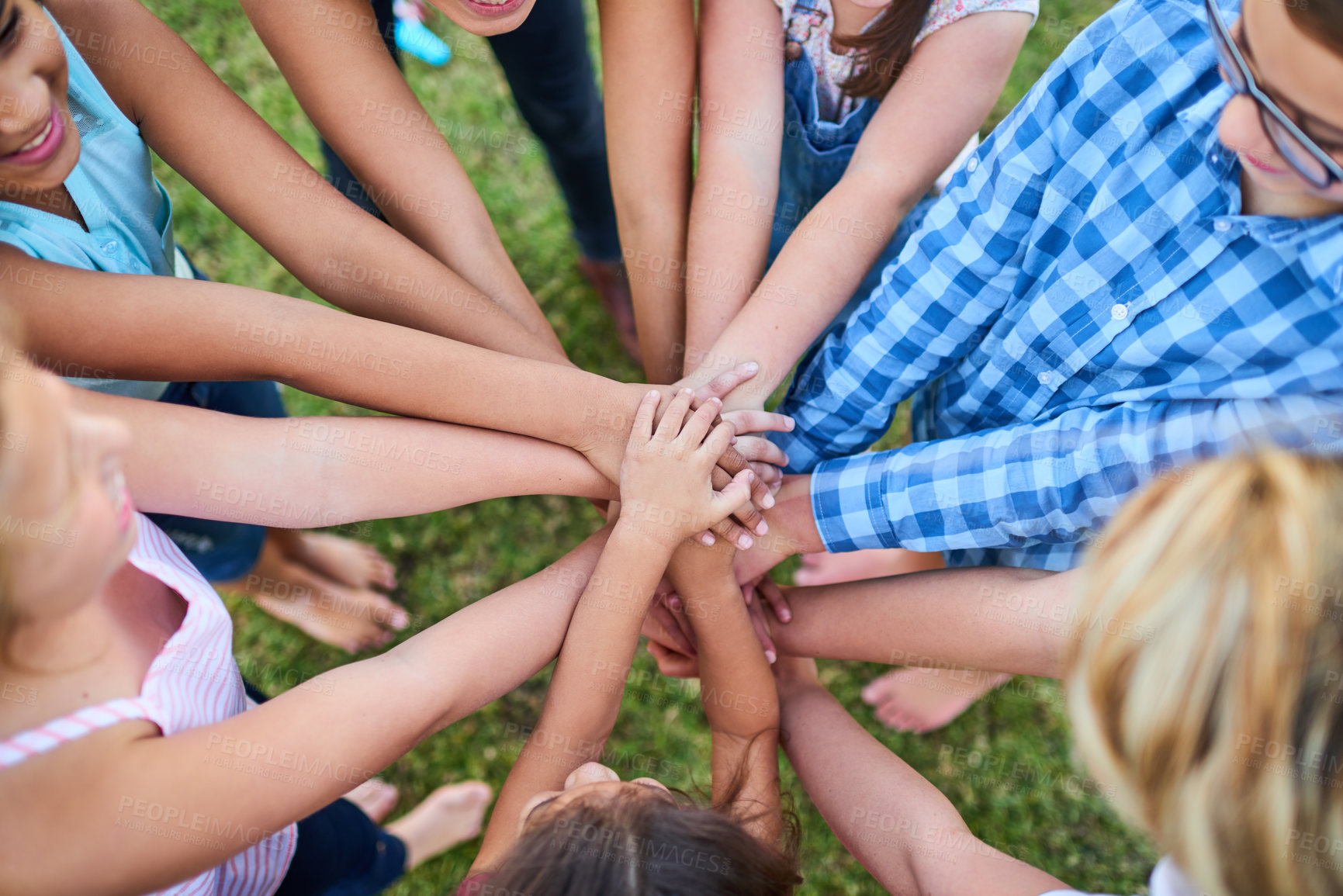 Buy stock photo Cropped shot of a group of kids stacking their hands on top of each other