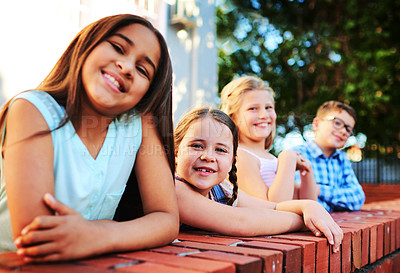 Buy stock photo Portrait of a group of young children playing together outside