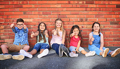 Buy stock photo Kids, wall and happy outdoor with thumbs up in portrait for fun, agreement and deal in New York. Friends, smile and yes with confidence or satisfied and excited with positivity, approval and support