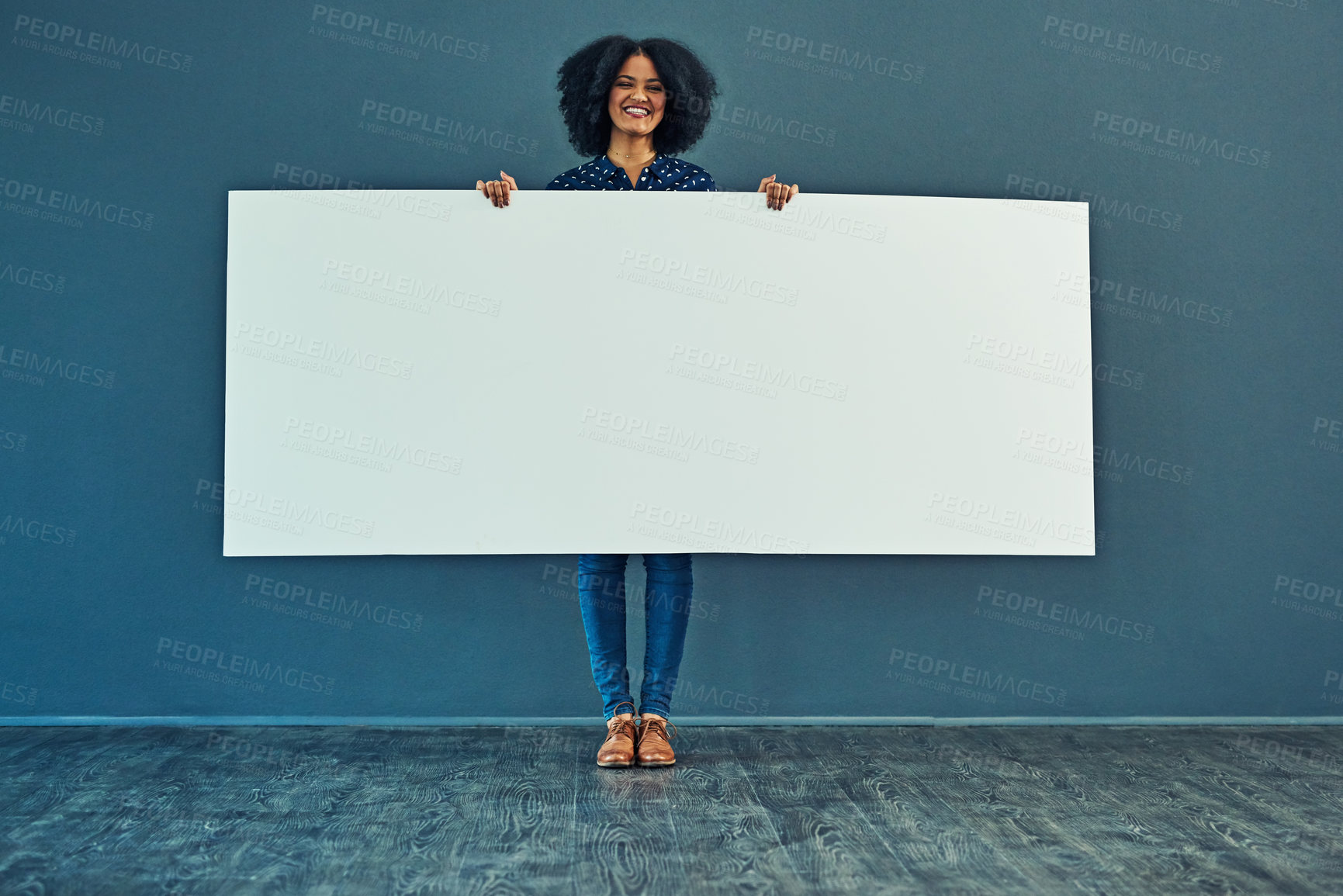 Buy stock photo Banner, mockup and portrait of happy woman in studio with billboard for news, social media or advertising on blue background. Space, paper and girl smile with poster, sign and branding promotion