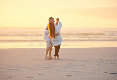 Buy stock photo Shot of a mature couple dancing on the beach