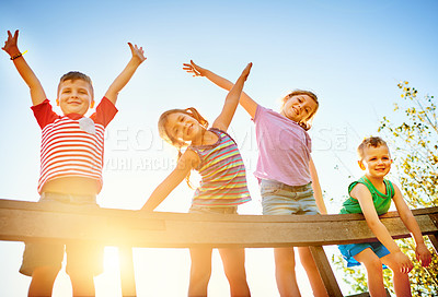 Buy stock photo Portrait of a group of little children playing together outdoors