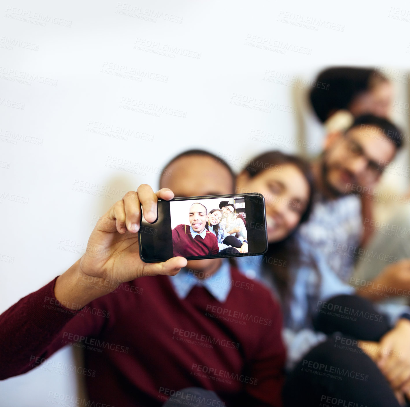 Buy stock photo Hands, phone screen and students for selfie, smile or funny face with diversity for photography at college. Men, women and friends for profile picture, education or memory on floor for social media