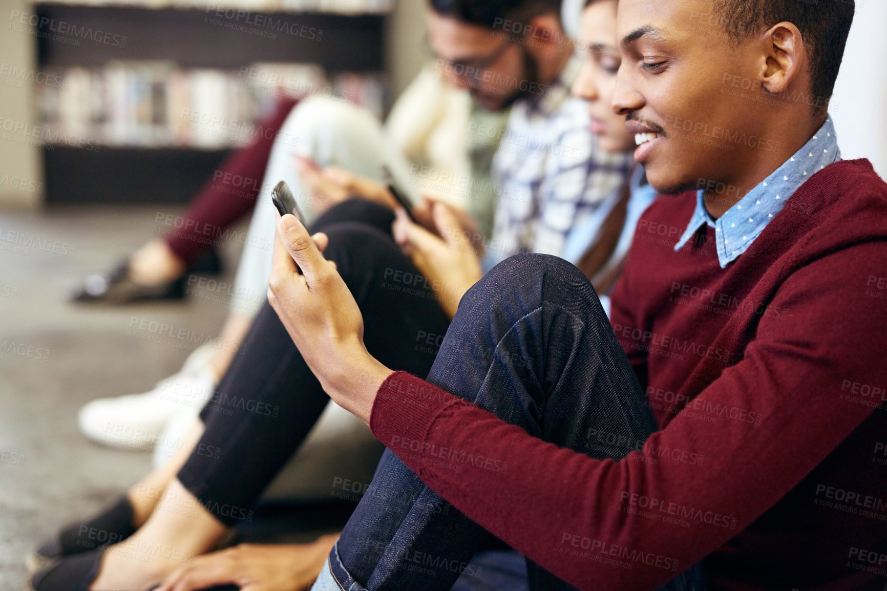 Buy stock photo Relax, happy man or students with phone on floor for social media, learning or study break. University, chill or people texting on mobile app for reading news or online registration at college campus