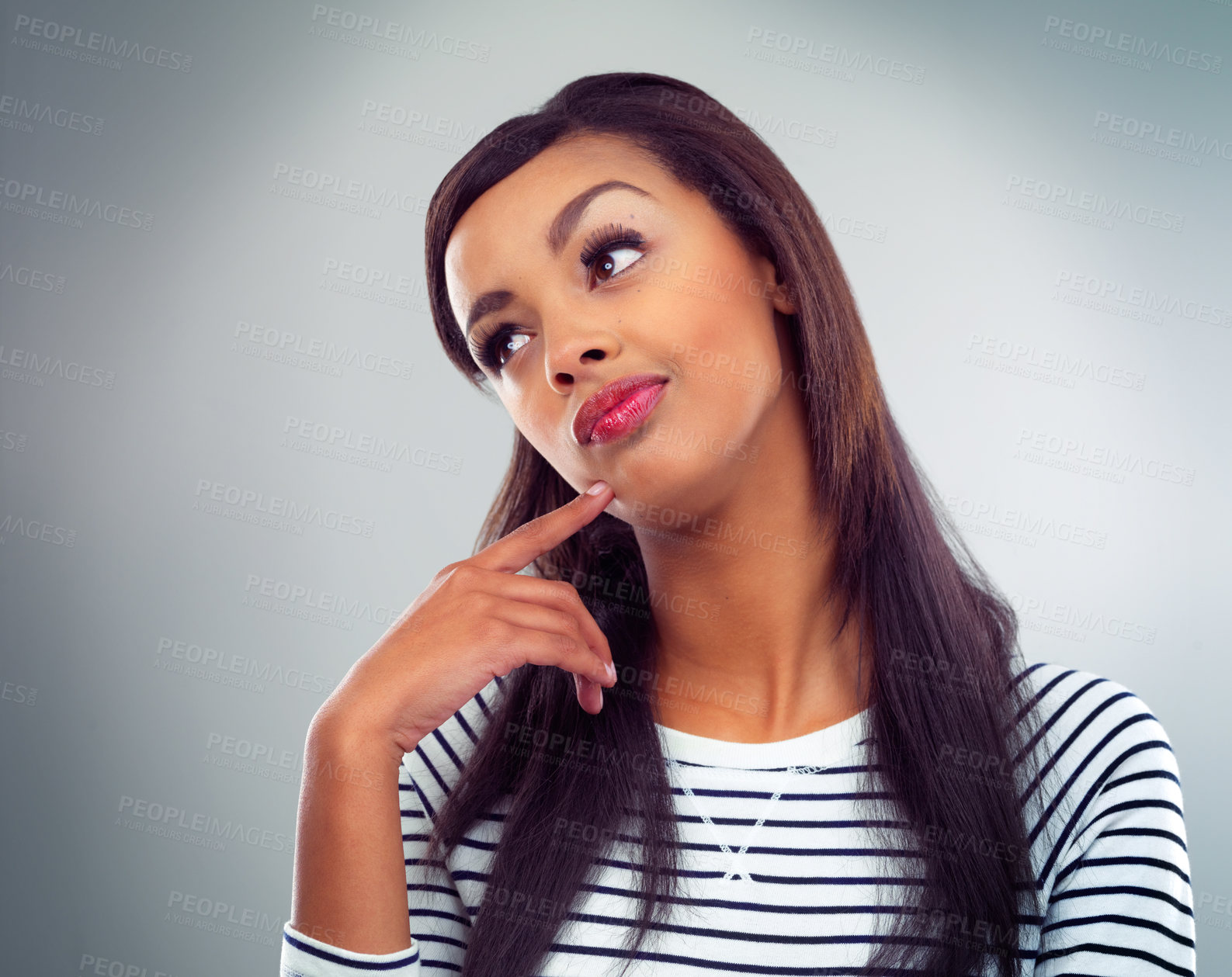 Buy stock photo Shot of a young woman posing against a grey background