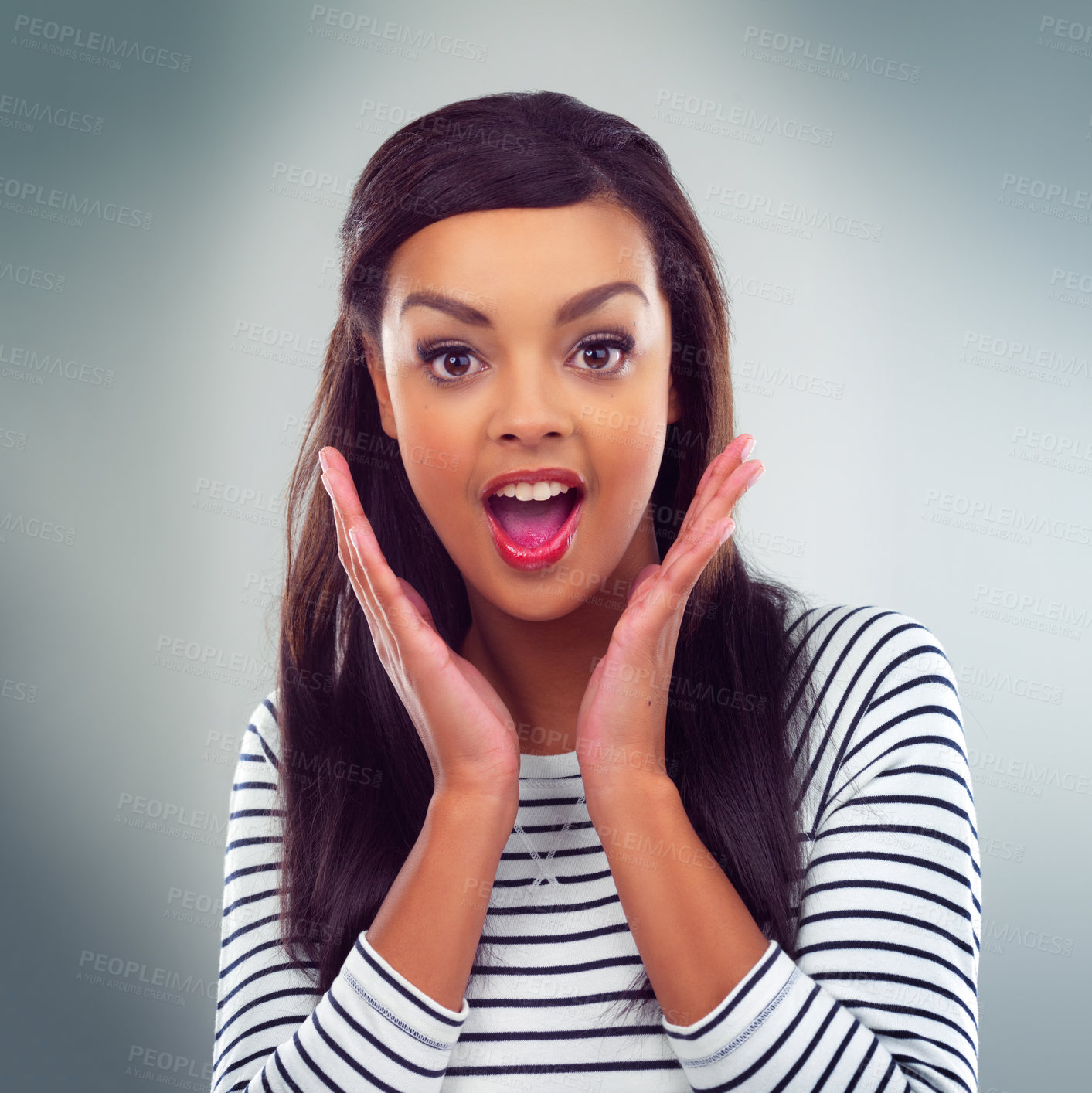 Buy stock photo Shot of a young woman posing against a grey background