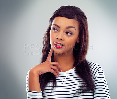 Buy stock photo Shot of a young woman posing against a grey background