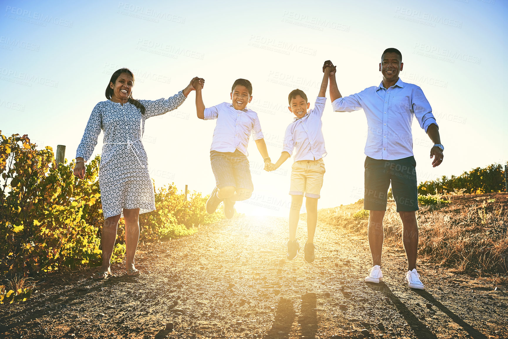 Buy stock photo Family, children and jumping on vacation, holiday or travel in Tuscany for bonding, memory and support. Woman, man and kids in outdoor for celebration, growth and development with flare in Italy