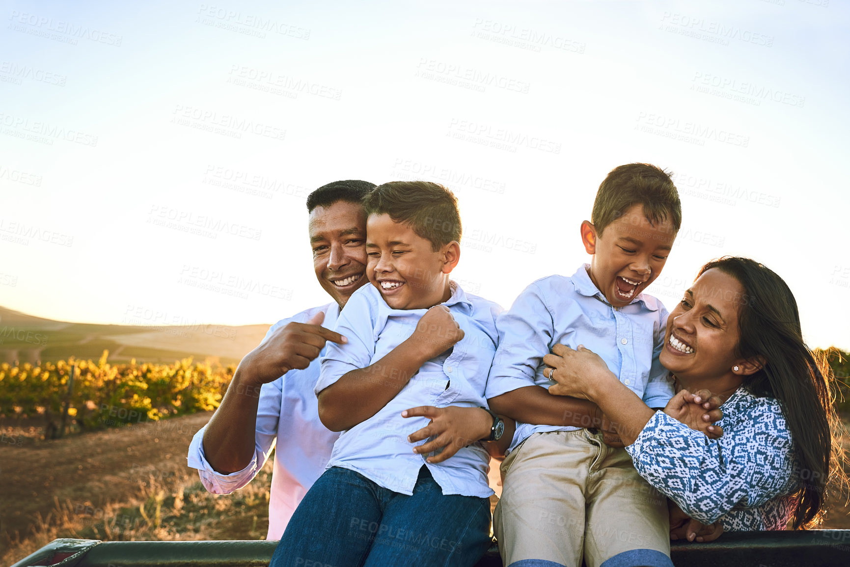 Buy stock photo Bonding, laughing and smile of family, outdoor and children with joy, happy or Latino parents in countryside. Nature, woman and man with kids, relax and love of mom or dad with youth, field or Mexico