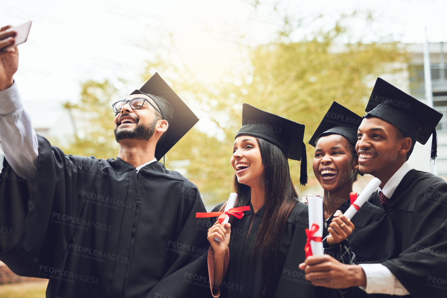 Buy stock photo Happy people, graduates and selfie with certificate for graduation memory, photography or celebration at university. Young, students and friends with smile for picture, academic achievement or degree