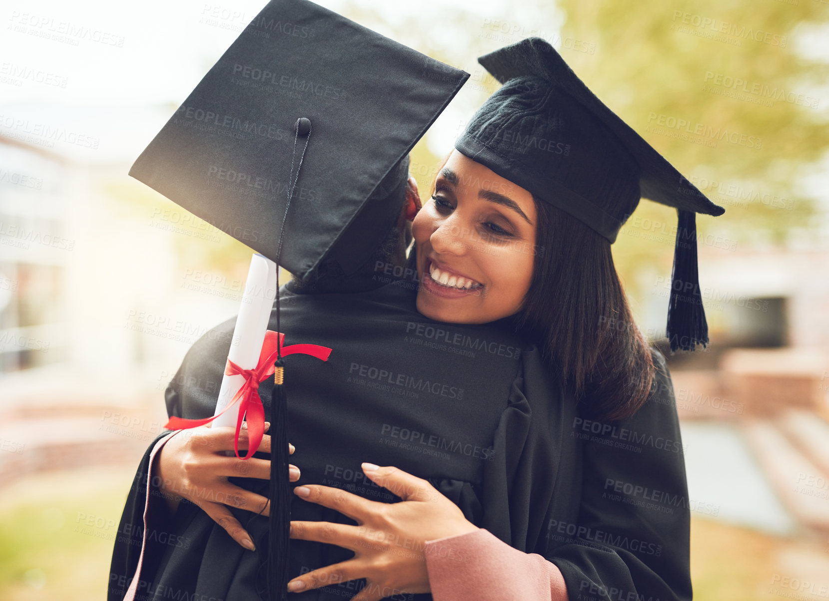 Buy stock photo Graduation, students and excited or hug for celebration outdoor on campus with support for education success. Friends, people and happy with diploma for university achievement and academic milestone