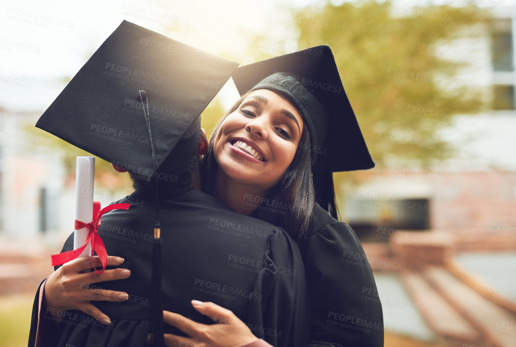 Buy stock photo Graduation, people and excited or hug for celebration outdoor on campus with support and education success. Graduate, student and person with diploma for university achievement and academic milestone