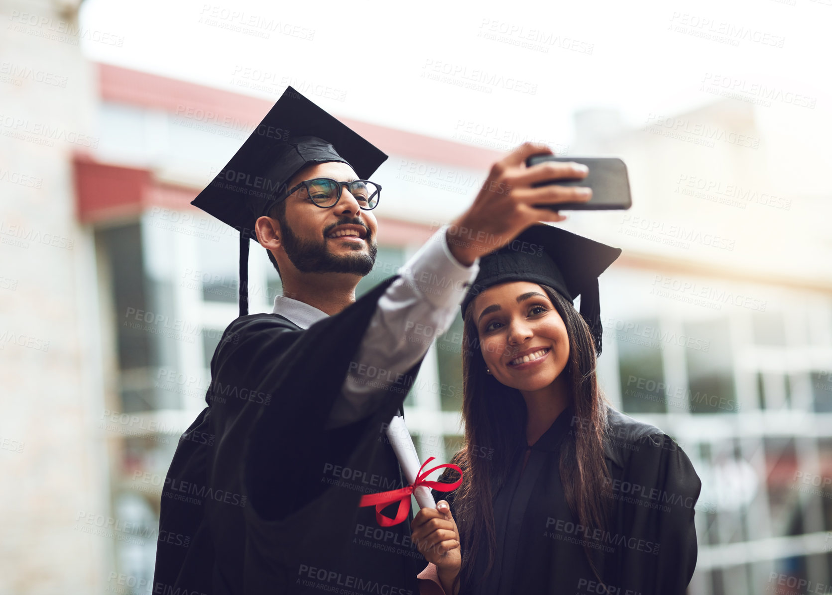 Buy stock photo Graduation, man and woman in selfie at university event for celebration, achievement and success in education. Photography, friends and happy students on college campus with diploma at award ceremony