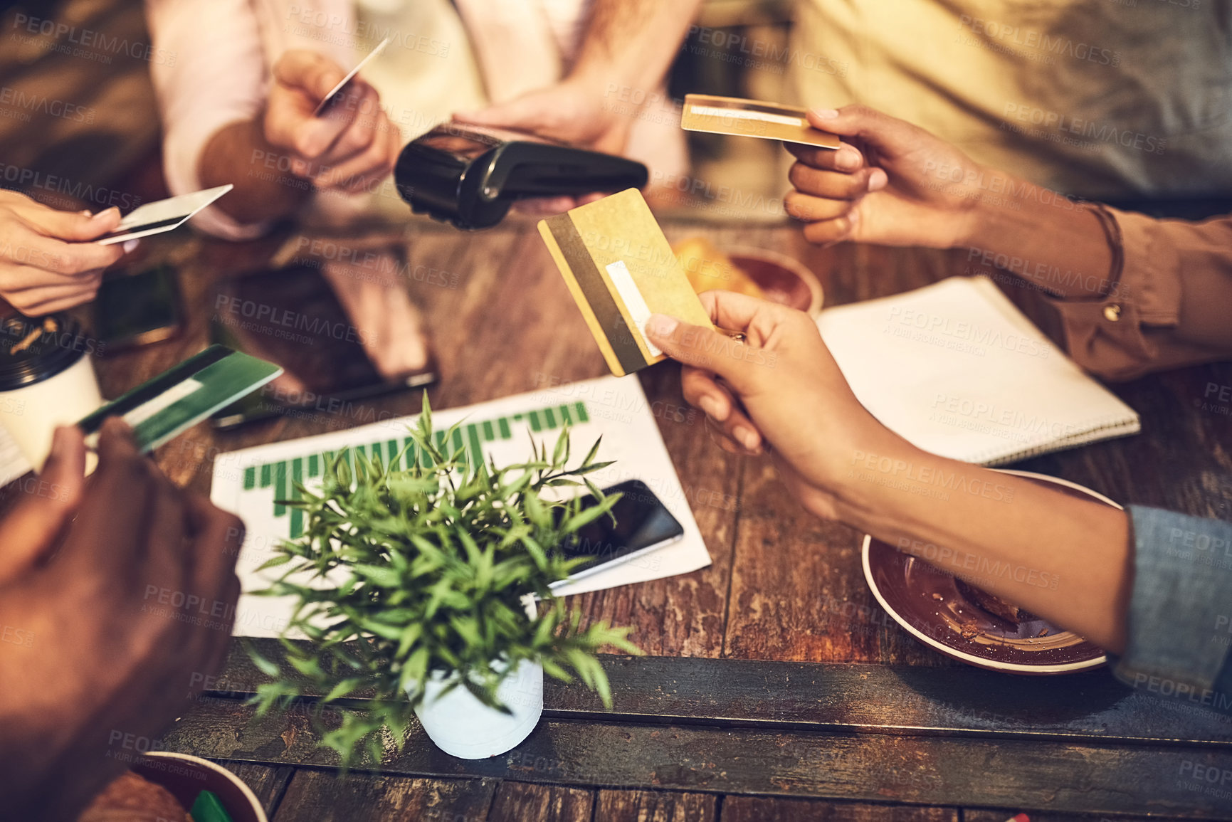 Buy stock photo Shot of unrecognizsble people wanting to pay with a credit card outside