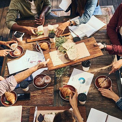 Buy stock photo High angle shot of a group of creative workers out on a business lunch