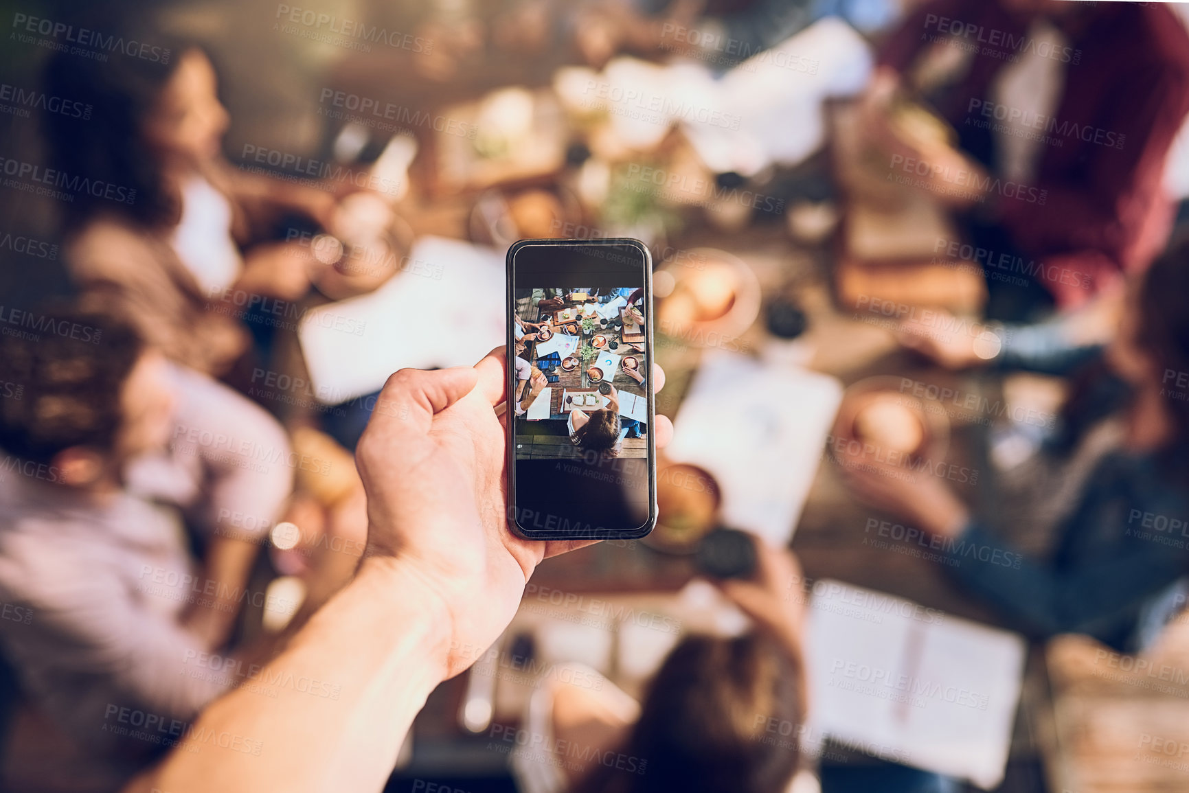 Buy stock photo Restaurant, hands and business people with phone screen for picture, document memory and networking. Cafe, mobile app and colleagues with food for brunch, lunch and team building in creative agency